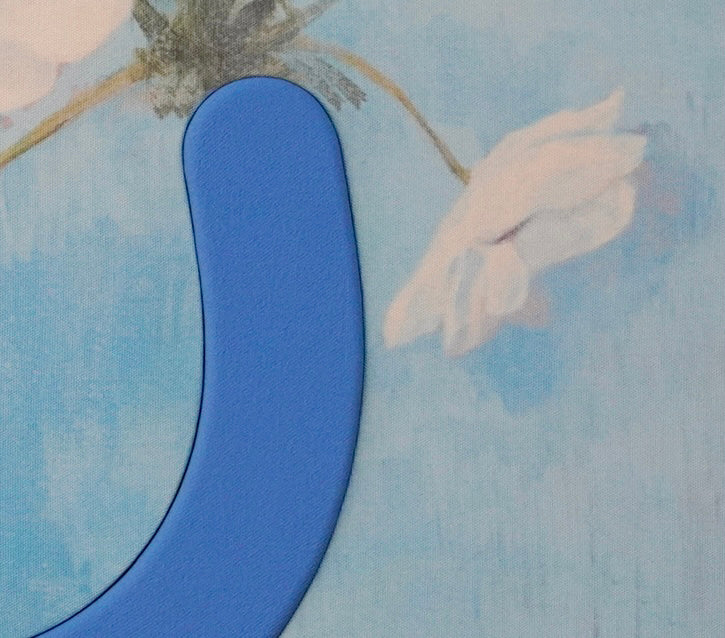 Blue abstract sculpture on a floral-patterned background